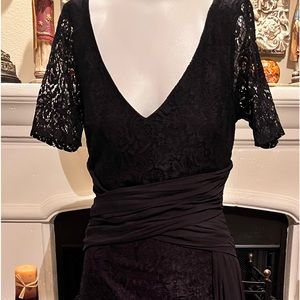 Great lace black lined v-neck 3/4 sleeve with sheer black attached sash.